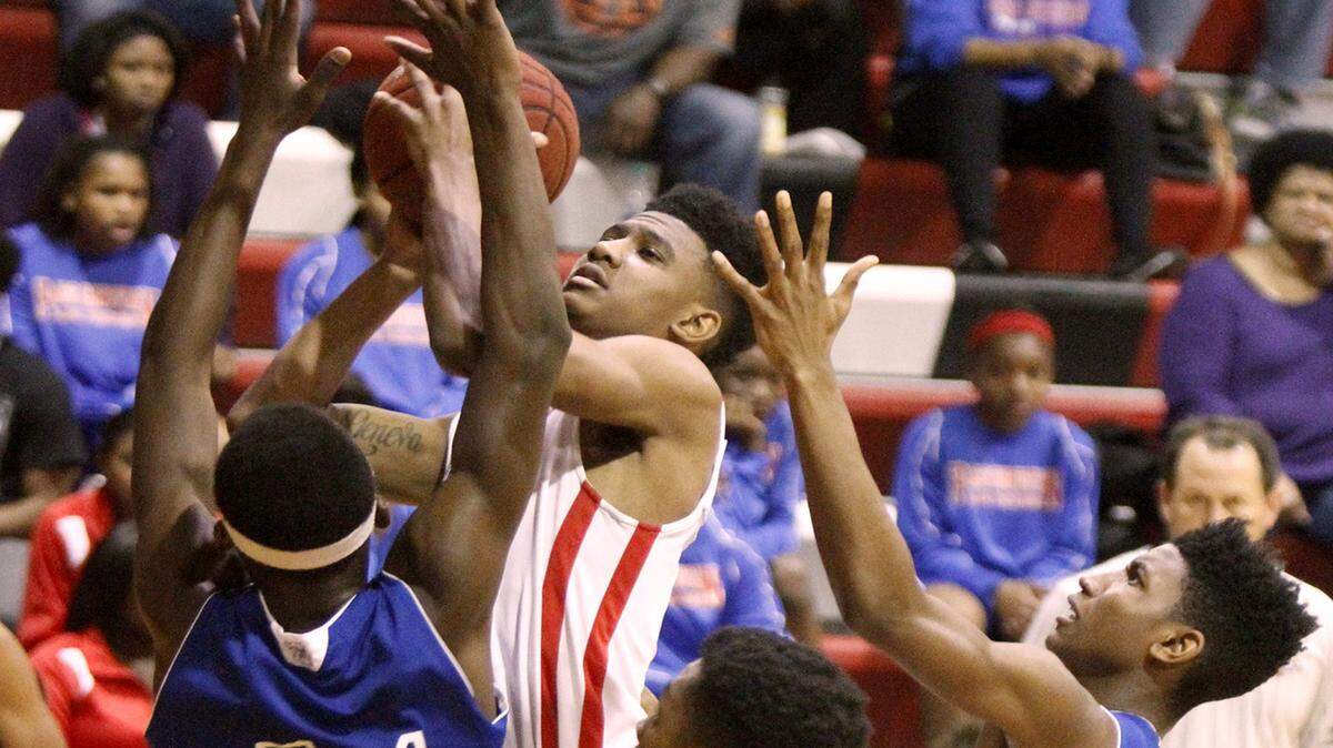 TIM ISBELL/SUN HERALD 
 Pass Christian's DeMarcus Boyd drives the lane to take a shot against Vancleave, Thursday, Feb. 18, 2016.