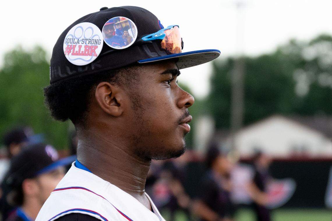 Sean Norvell wears a button honoring his friend Braylyn Knowles before a baseball game Thursday at Pascagoula.
