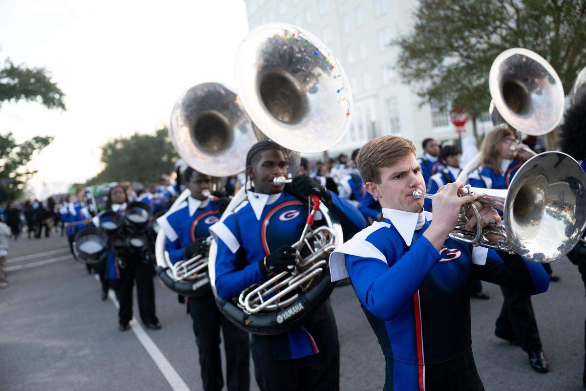 Gulfport band members play songs as they march during the Champions Christmas Parade in Gulfport on Monday, Dec. 8, 2025.