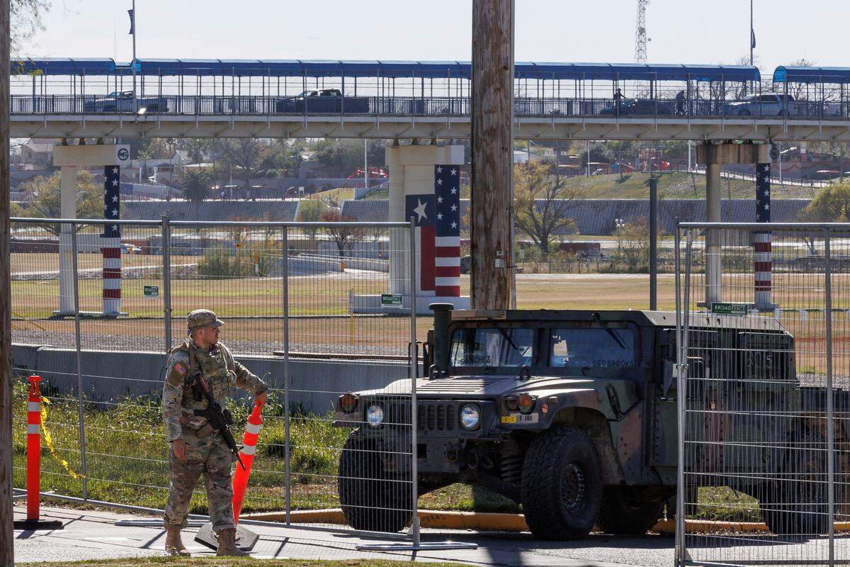 Texas Department of Public Safety officers guard an entrance to Shelby Park on Thursday in Eagle Pass, Texas.
