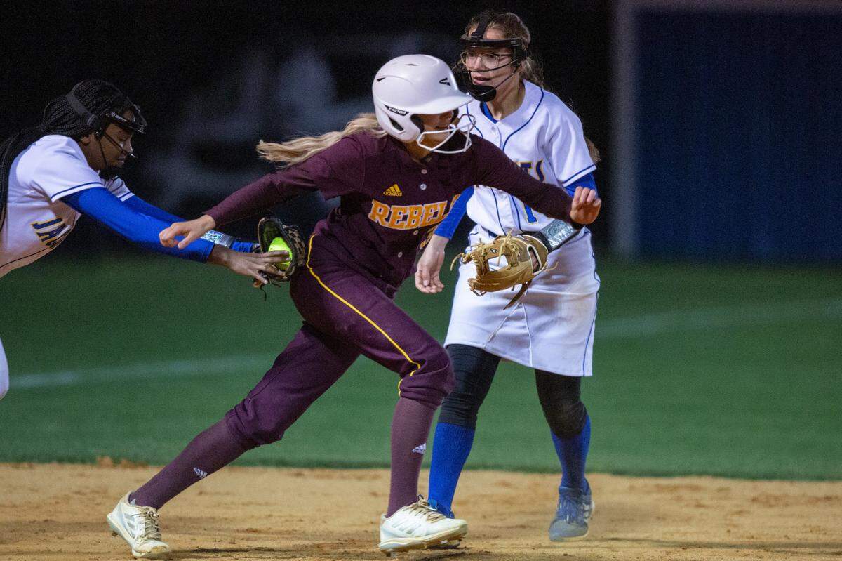 George County’s Gracie Magee gets tagged out by St. Martin during a game at St. Martin on Monday, March 20, 2023.