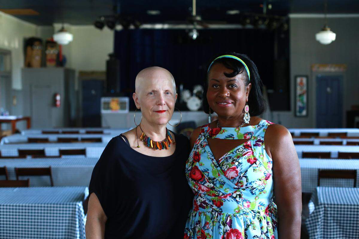 Rachel Dangermond, left, owns 100 Men Hall D.B.A in Bay St. Louis and recently started 100 Women D.B.A., a group of women whose mission is to support the hall and help women of color in their journey to open businesses and be empowered in Hancock County. Marian Glaser, right, is an artist and member of 100 Women who will soon host an art camp for young girls on the Coast.