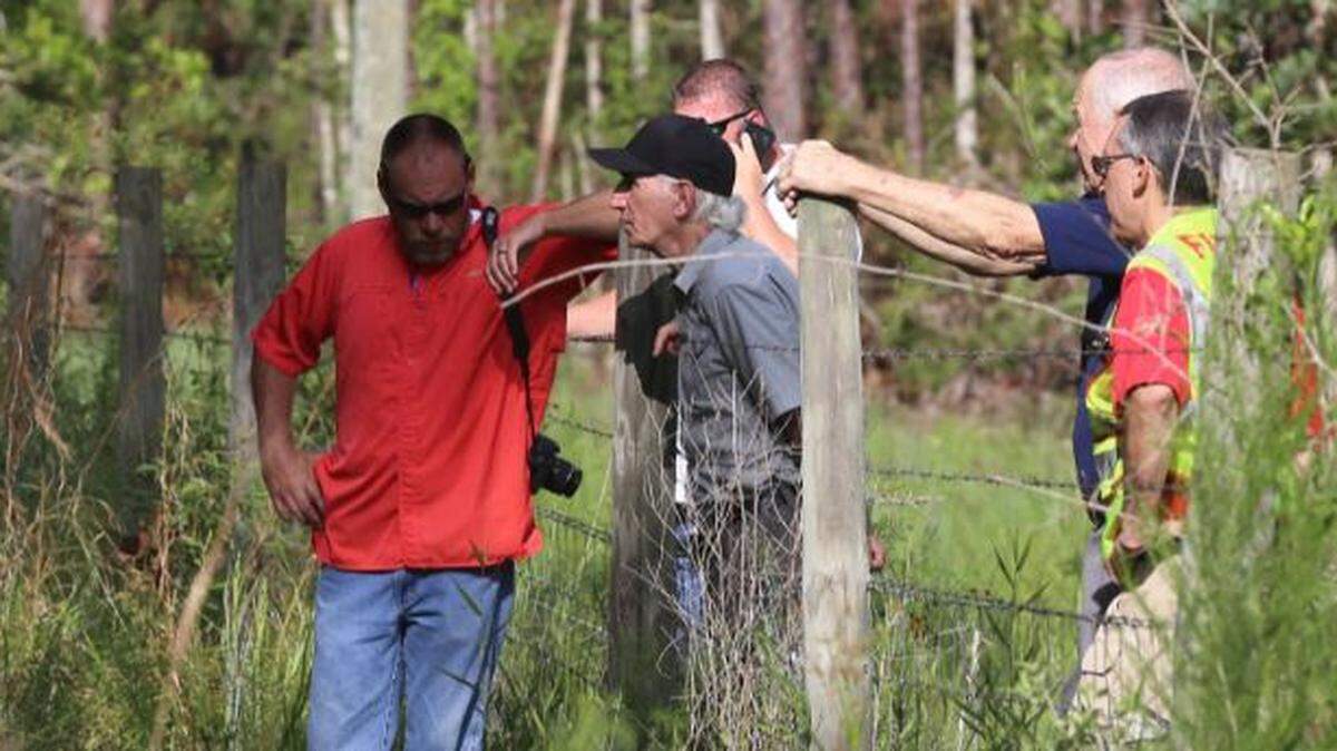 Hancock County Coroner Jim Faulk, center, won a third term in Tuesday’s runoff election since he has no Democratic challenger. He’s shown here with firefighters at the scene of a small plane crash in Diamondhead in 2018.