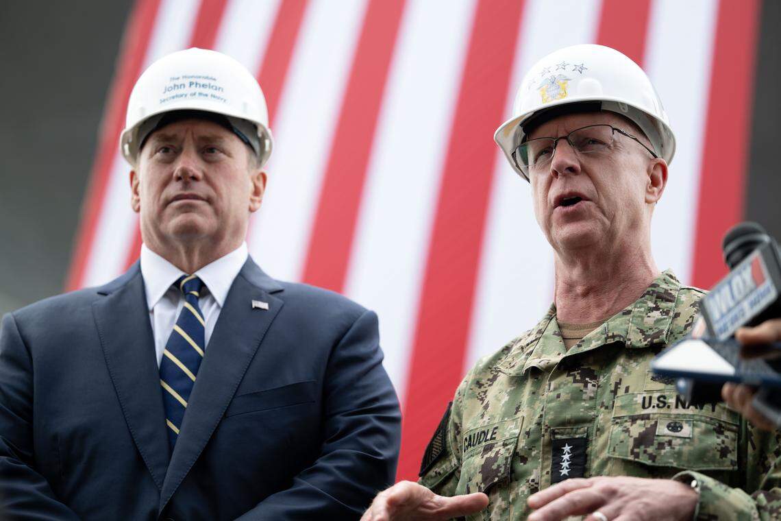 Admiral Daryl Caudle, right, and secretary of the Navy John Phelan, left, answer questions during a press conference at Ingalls Shipbuilding on Wednesday, Jan. 7, 2026.