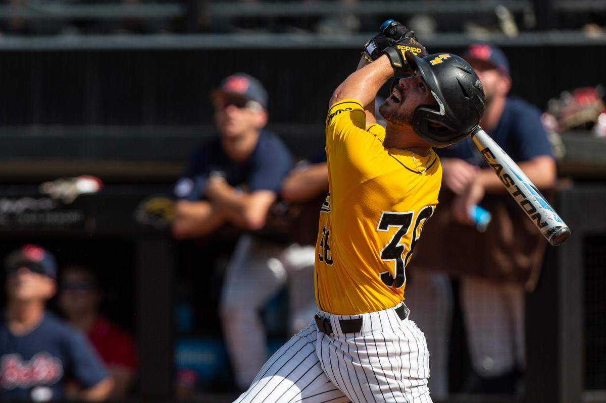 Southern Miss’s Reece Ewing looks up as he hits a pop fly during the Super Regionals Final at Pete Taylor Park in Hattiesburg on Sunday, June 12, 2022.
