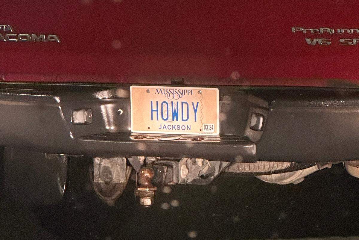 This friendly license plate reads “HOWDY”.