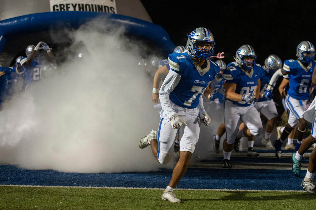 Ocean Springs runs out onto the field before their game against Gulfport at Greyhound Stadium in Ocean Springs on Friday, Oct. 28, 2022.