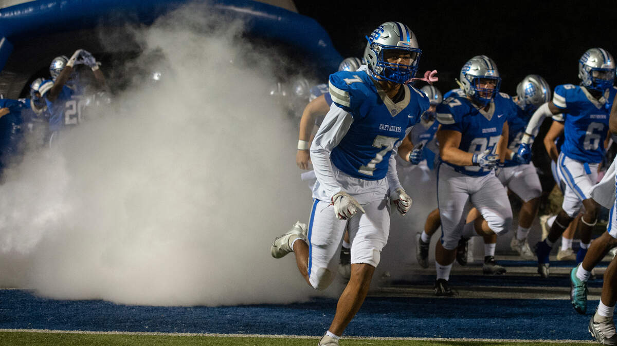 Ocean Springs runs out onto the field before their game against Gulfport at Greyhound Stadium in Ocean Springs on Friday, Oct. 28, 2022.