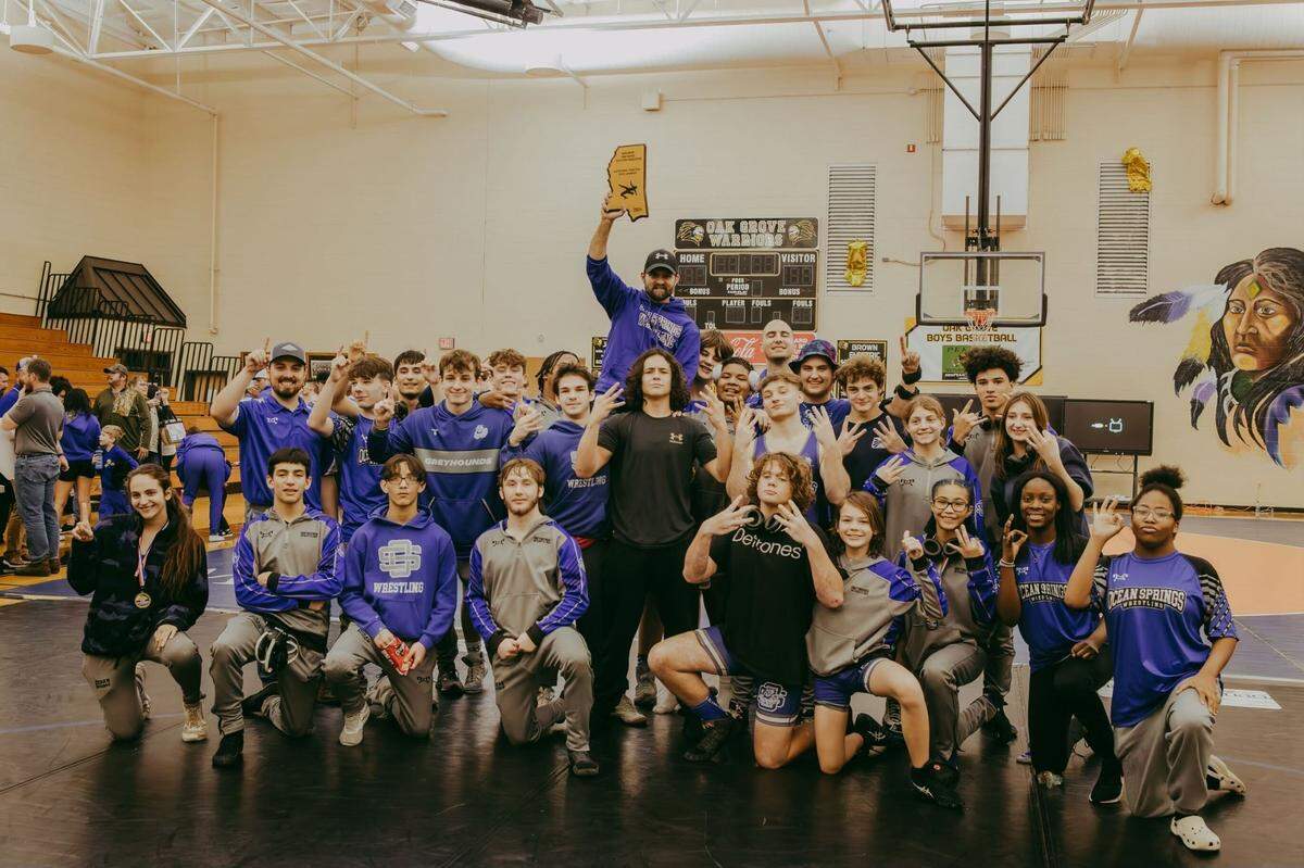 The Ocean Springs Greyhounds celebrating their third state championship win at Oak Grove High School.