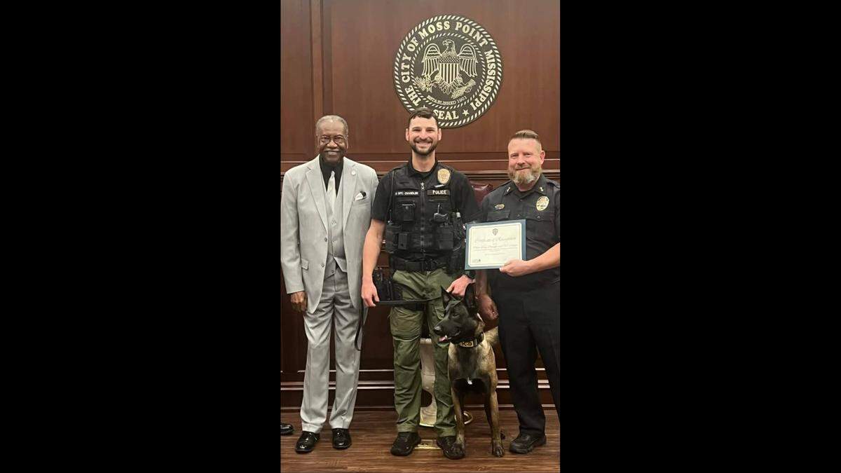 Moss Point Mayor Billy Knight, left, is pictured here with Police K-9 Officer Craig Chandler, and Police Chief Brandon Ashley