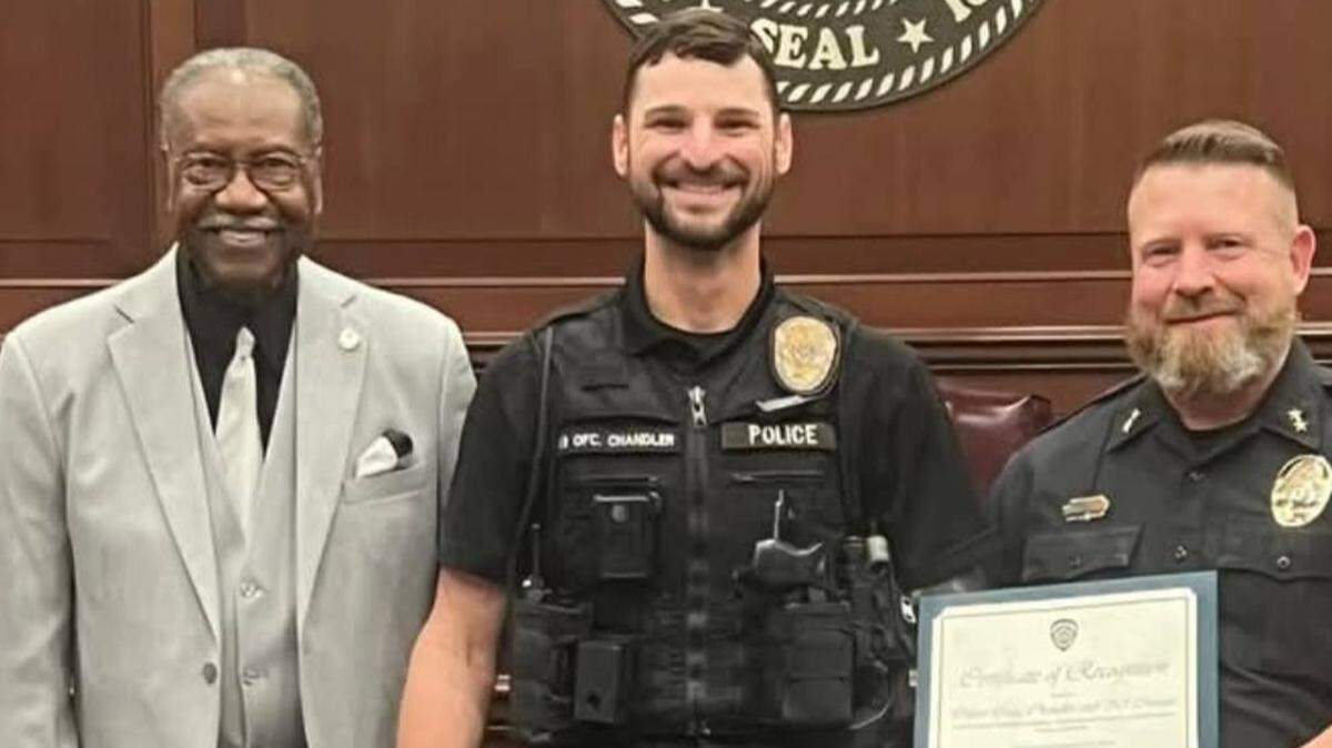 Moss Point Mayor Billy Knight, left, is pictured here with Police K-9 Officer Craig Chandler, and Police Chief Brandon Ashley