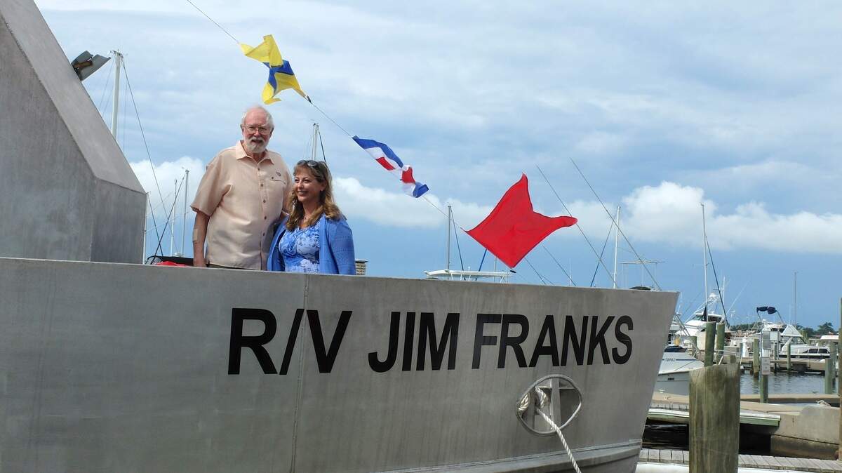Fisheries scientist Jim Franks, the longest-serving employee of USM’s Gulf Coast Research Laboratory in Ocean Springs, stands with Jill Hendon in 2016 at the dedication of the research vessel named after him. Hendon was proud to serve as benefactor at the dedication.