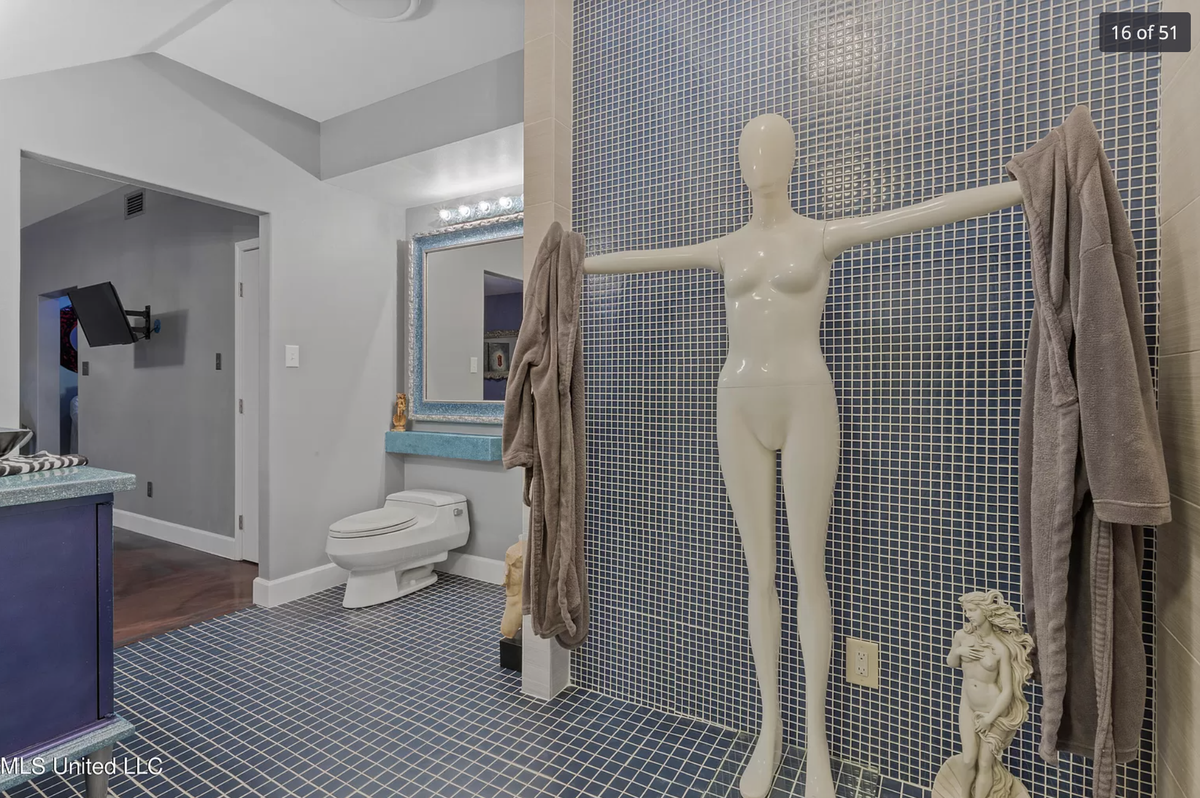 A home for sale on Graveline Road in Gautier has purple and orange walls, mirrors and mannequins throughout.