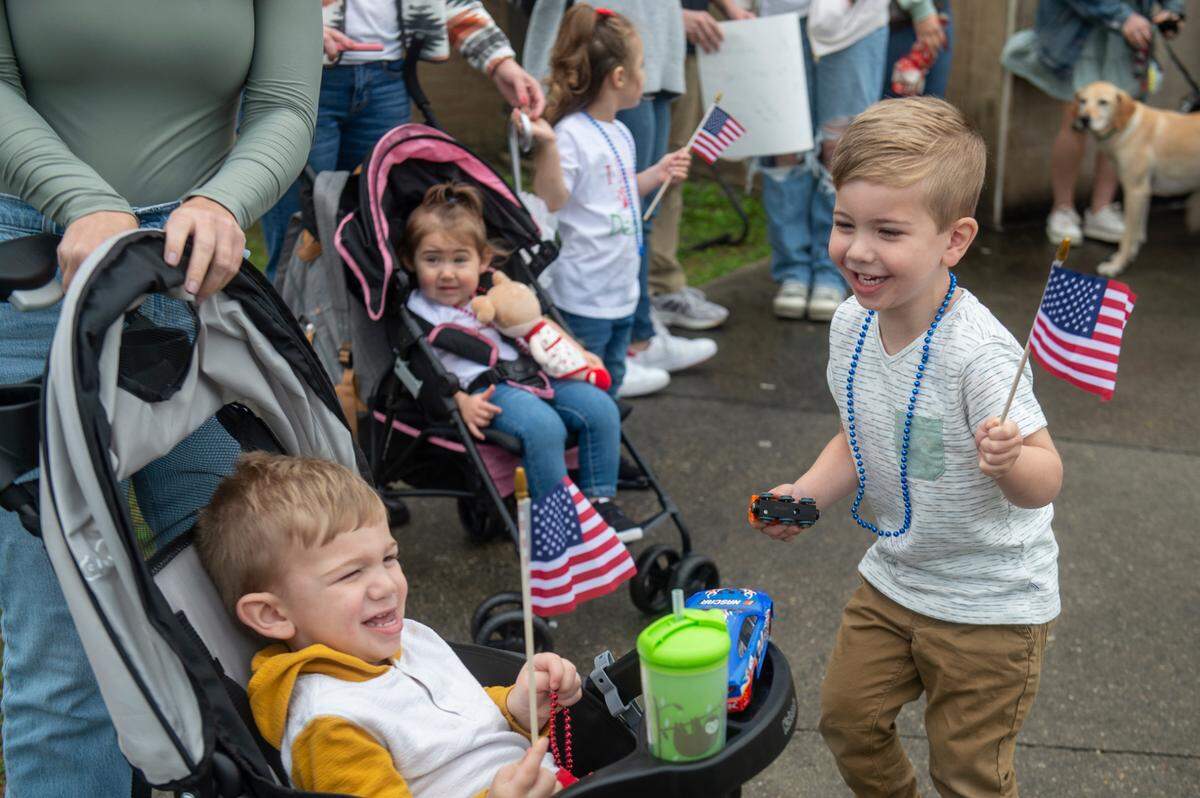 Henry Friedrich, 1, and Carter Friedrich, 3, wait for their father Conrad Friedrich, a member of Naval Mobile Construction Battalion 133, to return from deployment at a homecoming event at the Naval Construction Battalion Center in Gulfport on Tuesday, March 5, 2024.