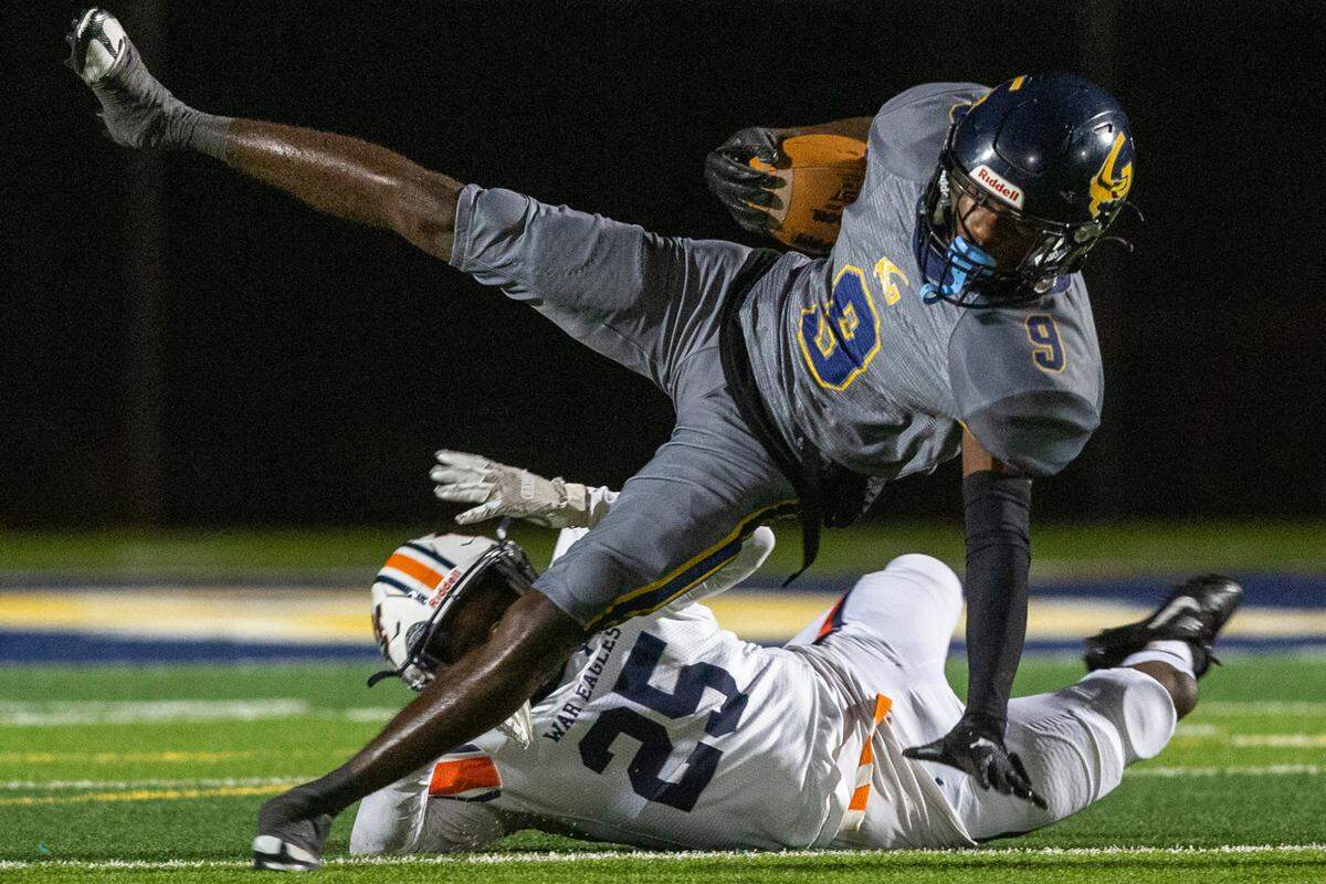 Gautier’s Kelvin Beavers gets tackled by Wayne County during a playoff game at Gautier High School in Gautier on Friday, Nov. 11, 2022.