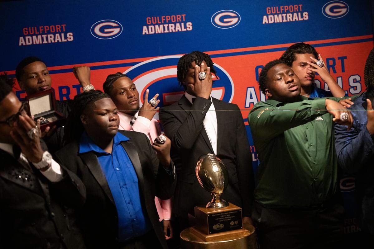 Gulfport players pose with their new state championship rings and the 7A state champion trophy.
