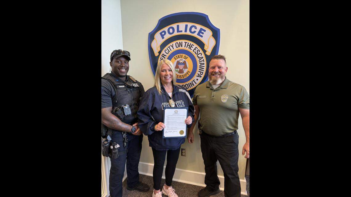 Moss Point Police Officer Tyrone Baker, Sgt. Kimberly Snowden and Police Chief Brandon Ashley are pictured here after the city passed a proclamation honoring law enforcement officers who lost their lives in the line of duty as part of National Police Week.