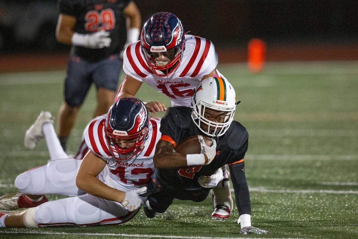 West Harrison’s Tyson Johnson gets tackled during a game at West Harrison High School in Harrison County on Friday, Oct. 6, 2023.