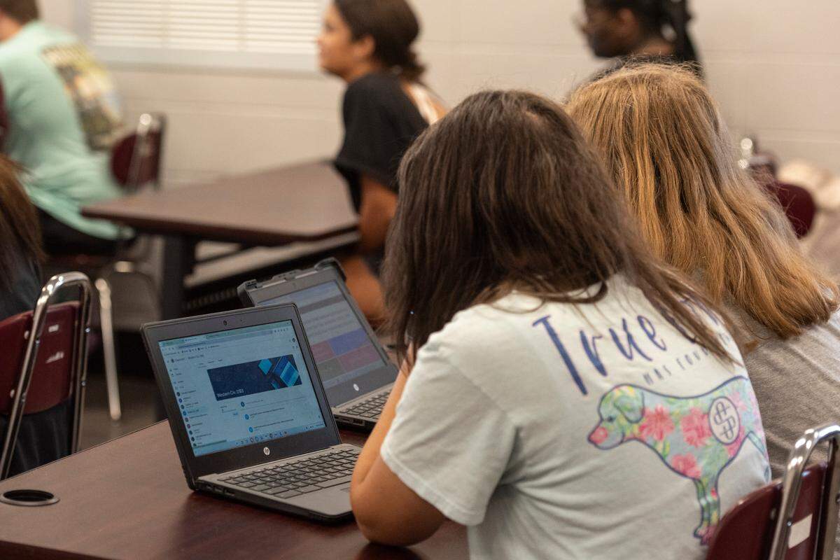 Students work on laptops during a civics class at Long Beach High School on Thursday, Sept. 26, 2024. High schools across the country have been dealing with an increase of threats.