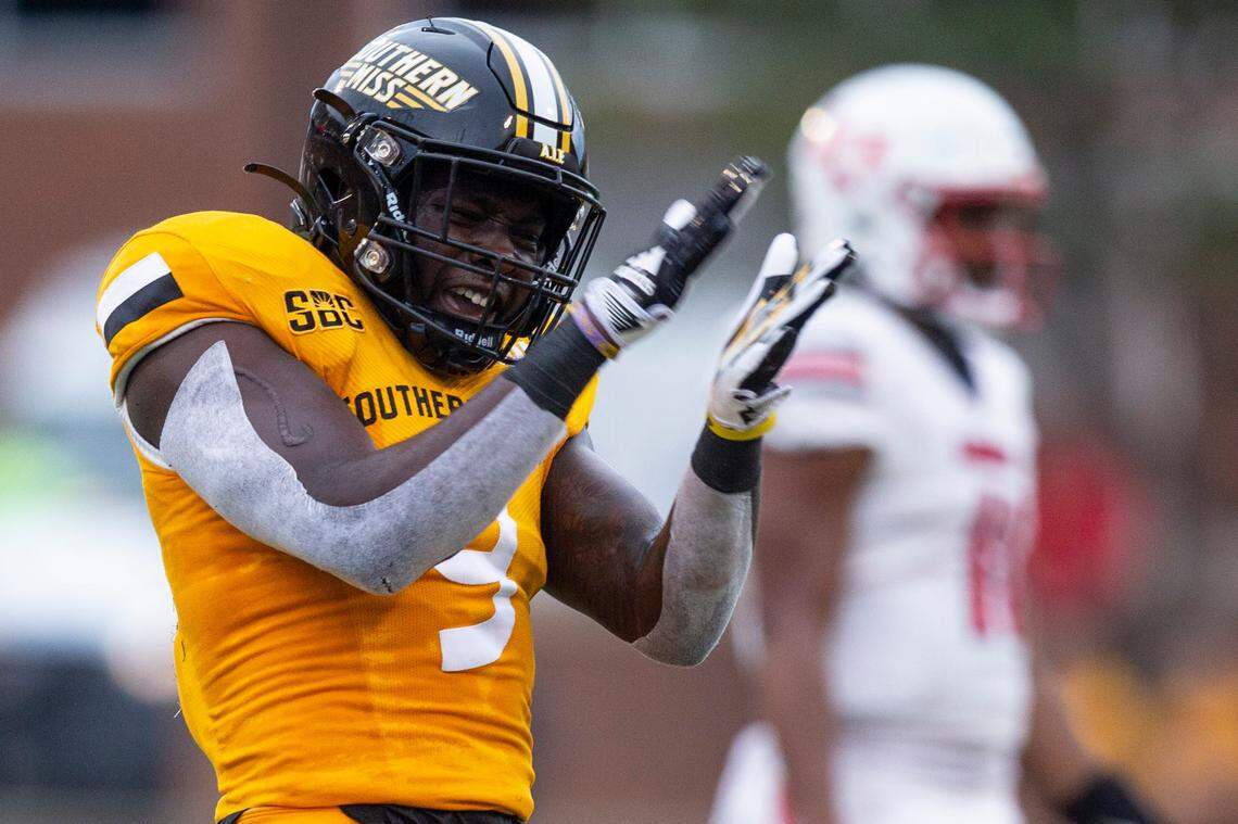 Southern Mississippi quarterback Tee Webb (9) cheers after a play against Liberty during a NCAA college football game in Hattiesburg, Miss., Saturday, Sept. 3, 2022. Southern Mississippi lost 29-27