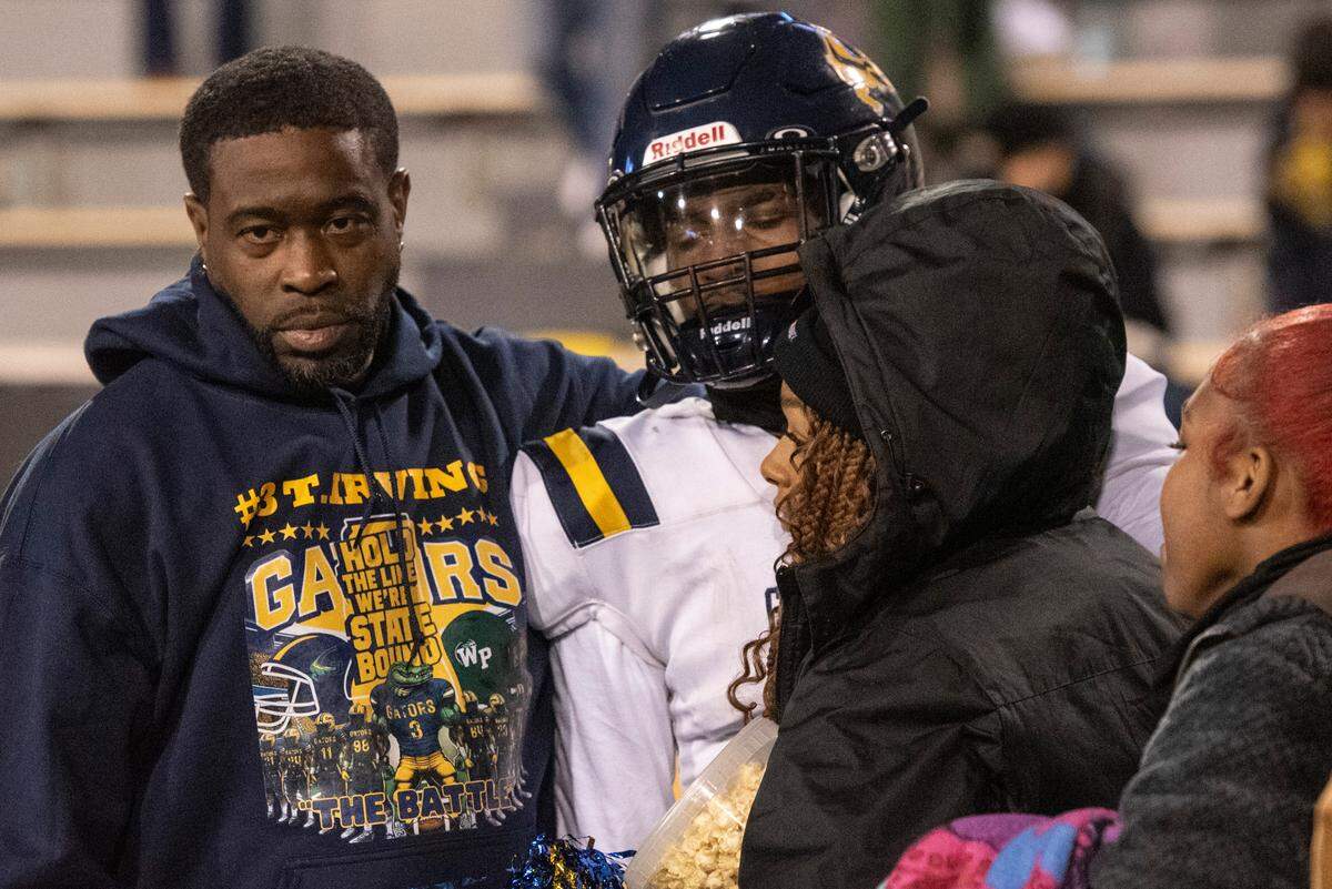 Gautier quarterback Trey Irving reacts with his family after Gautier lost the MSHAA Class 5A Football Championship at M.M. Roberts Stadium in Hattiesburg on Friday, Dec. 6, 2024.