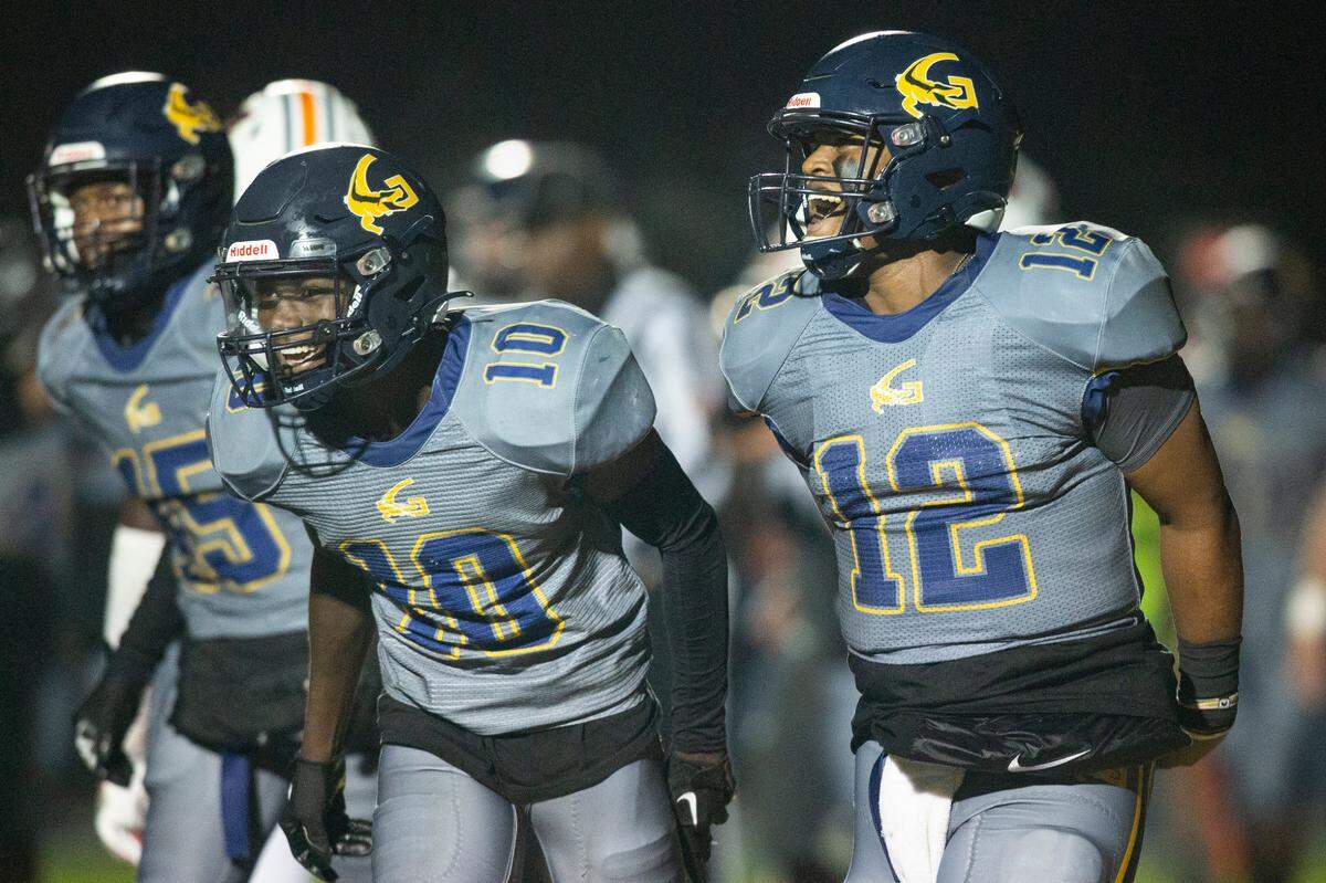 Gautier’s Kaden Irving and AJ Phillips celebrate after a touchdown during a playoff game against Wayne County at Gautier High School in Gautier on Friday, Nov. 11, 2022.