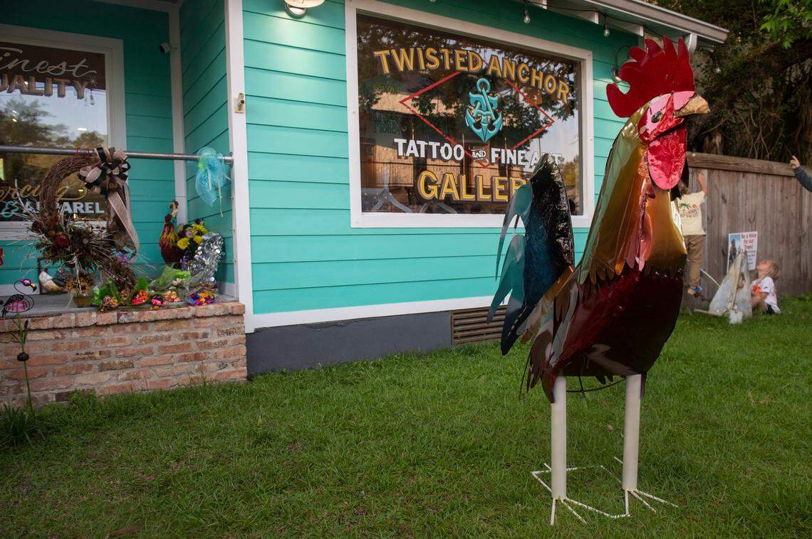 A statue of Carl the rooster stands outside Twisted Anchor Tattoo, a former stopping ground for the rooster, in Ocean Springs on Tuesday, May 10, 2022.