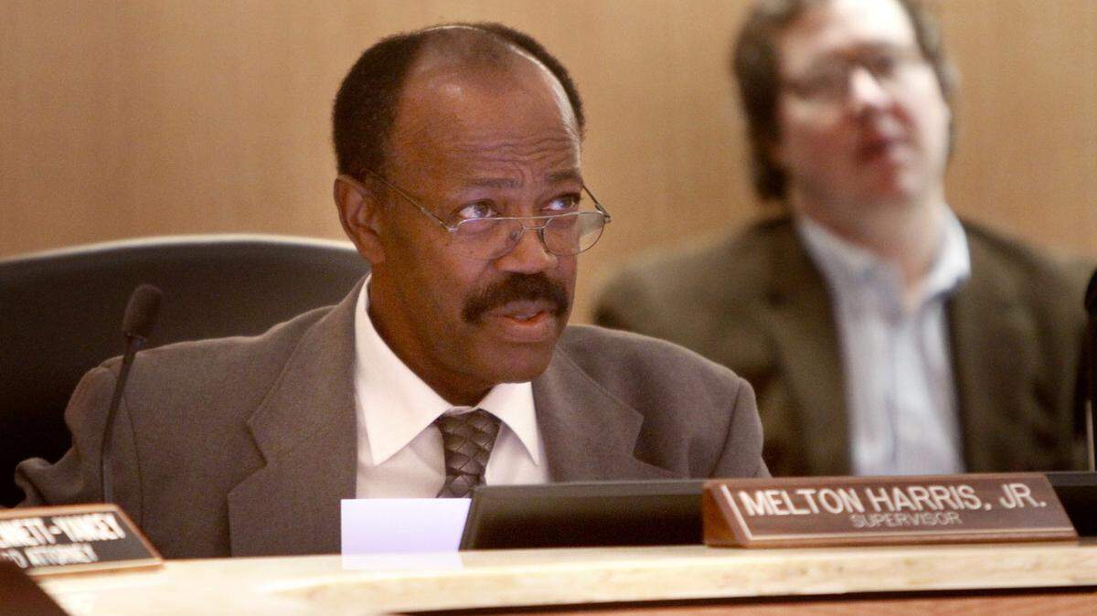 Melton Harris Jr. listens to public comments portion of the Jackson County Board of Supervisors meeting in 2014. Harris died on Tuesday.