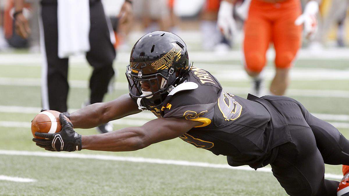 TIM ISBELL/SUN HERALDSouthern Miss receiver Mike Thomas dives for the Golden Eagles first touchdown, Saturday, Oct. 31, 2015. 