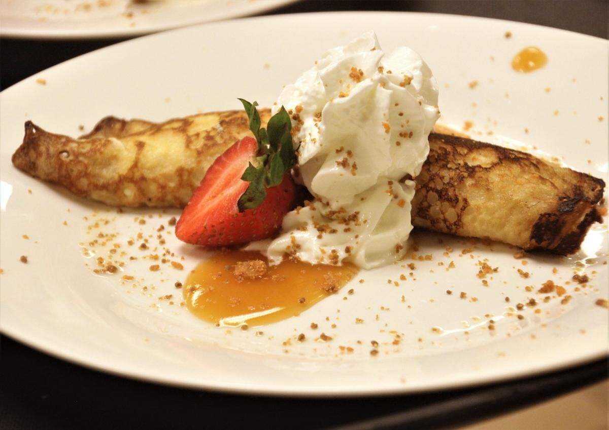 Buttermilk Crepes with buttermilk custard, peaches and wild berry compote was one of 10 courses served at the Muddy Waters Supper Club on Friday, Aug. 7, 2020, at Lynn Meadows Discovery Center in Gulfport.