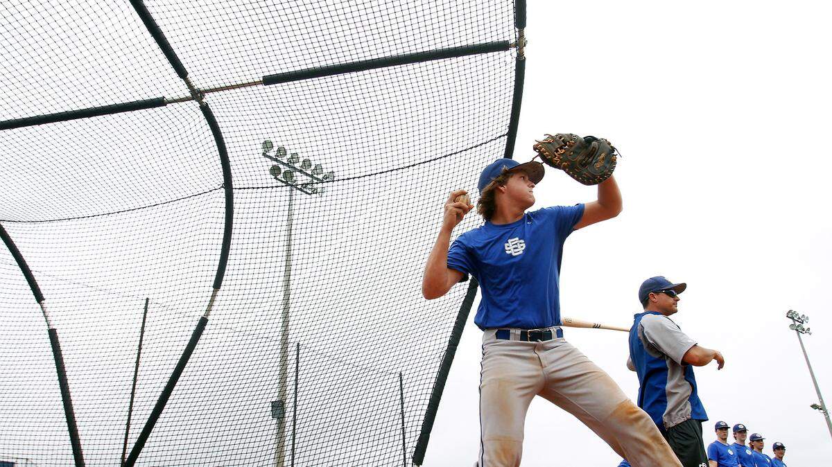 AMANDA McCOY/SUN HERALD 
 Ocean Springs catcher Tate Pepper shined for the Greyhounds on Friday against D'Iberville.