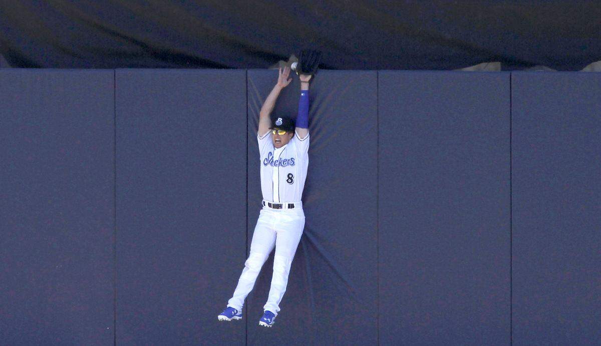TIM ISBELL/SUN HERALDBiloxi Shucker Brett Phillips misses catching a home run by Milwaukee's Ryan Braun "by that much" during exhibition game at MGM Park, Saturday, Apr. 2, 2016. 