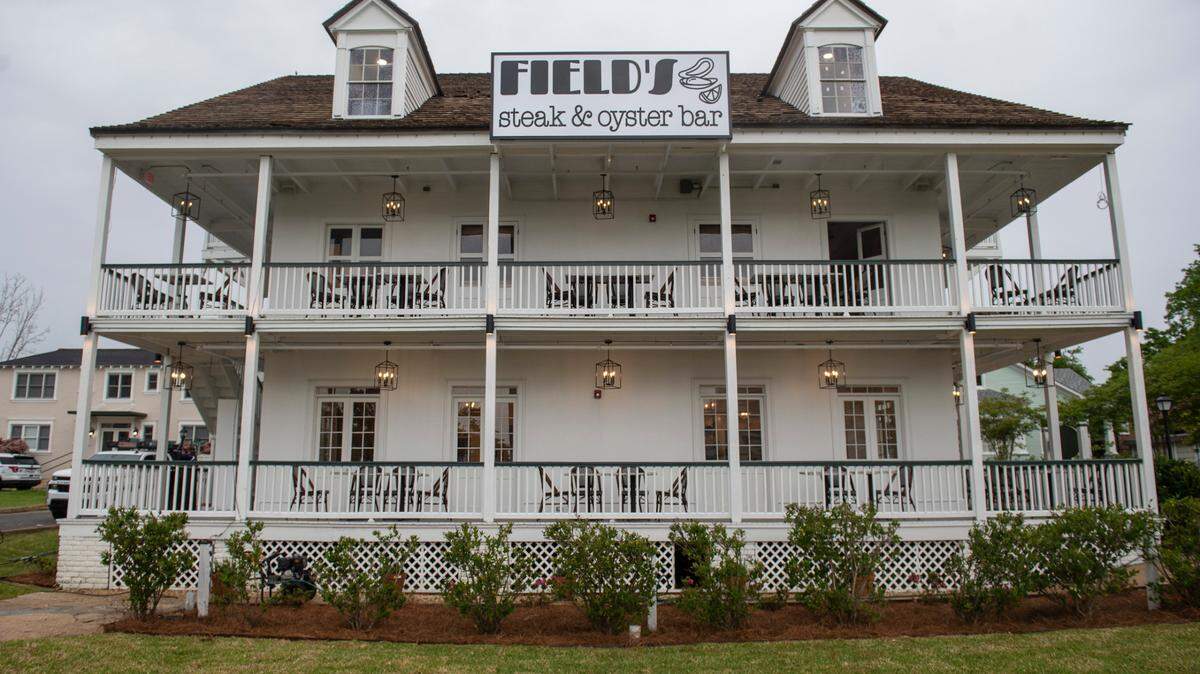 Lanterns illuminate the double wraparound porches at Field’s Steak and Oyster Bar in Biloxi on Monday, April 11, 2022. The new restaurant opens this weekend in the historic Magnolia Hotel building in downtown.