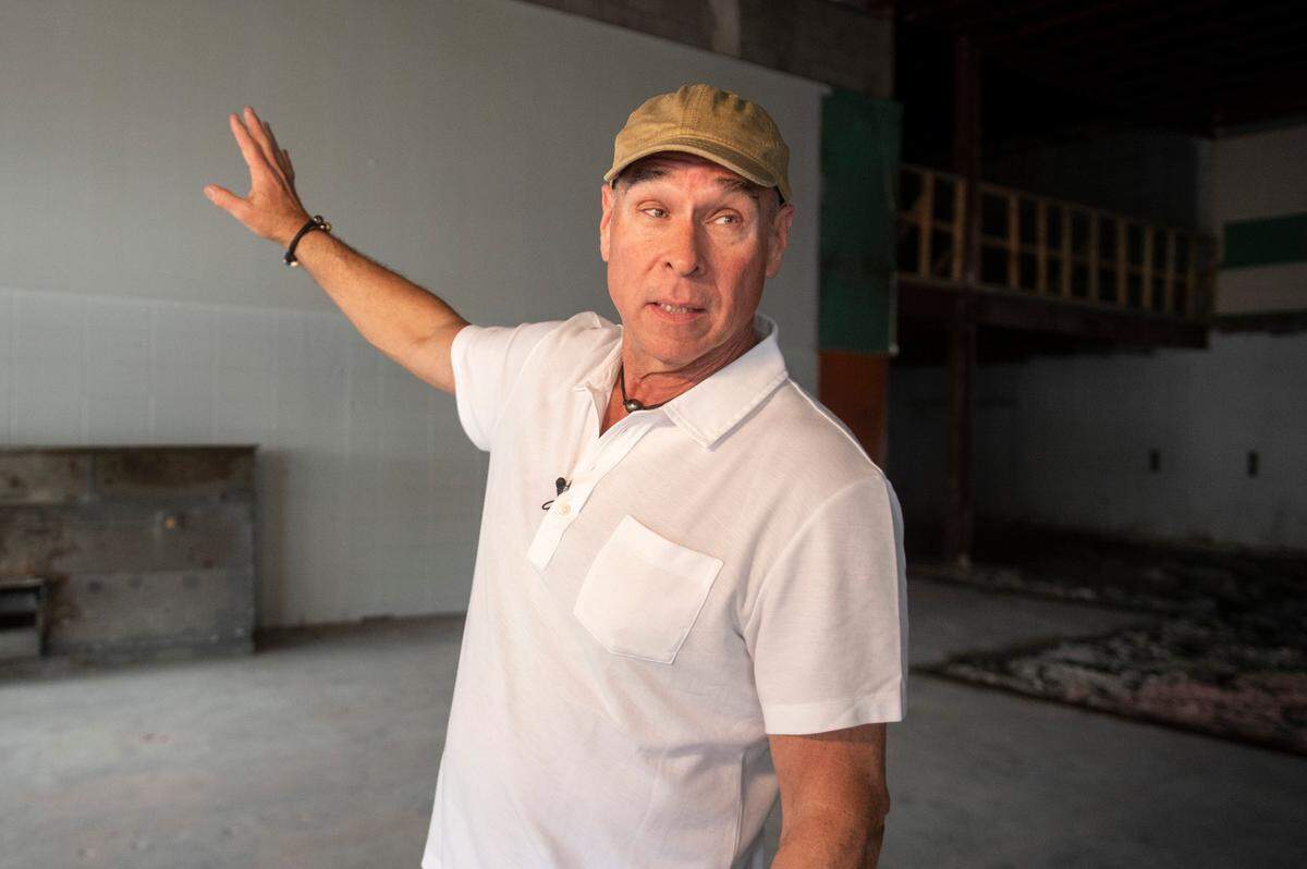 Restaurateur Robert St. John gives a tour of what will be his new restaurant, The Downtowner, in Gulfport on Feb. 7, 2025. A year later, renovations at the restaurant continue ahead of the opening later this year.