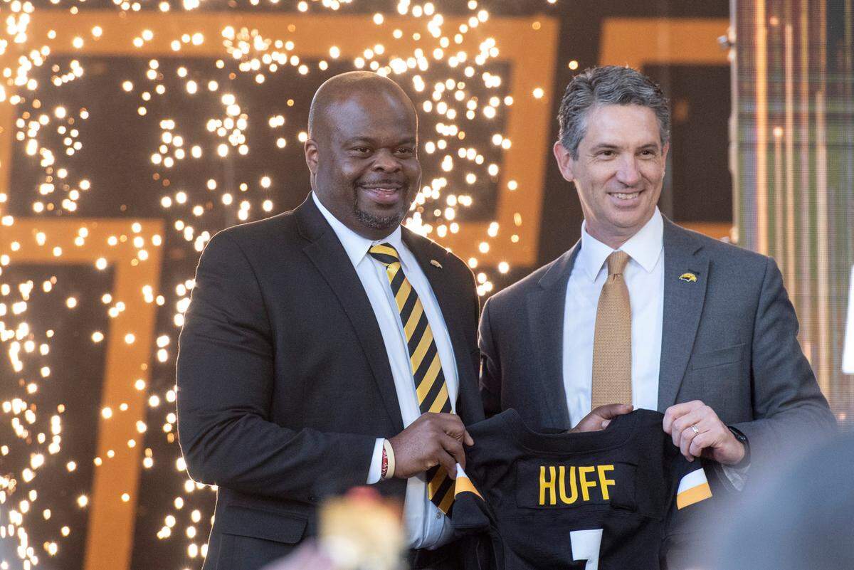 Southern Miss Athletic Director Jeremy McClain poses with new head football coach Charles Huff during a public welcome celebration for Huff at The Rock in Hattiesburg on Thursday, Dec. 12, 2024.