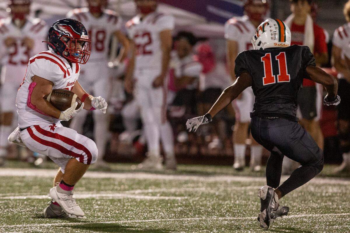 Hancock’s Jeffery Hopgood runs the ball down the field during a game at West Harrison High School in Harrison County on Friday, Oct. 6, 2023.