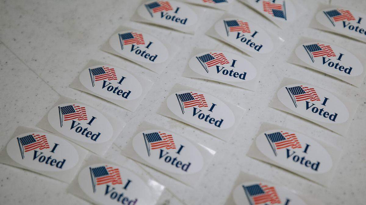 “I Voted” stickers are lined up on a table to give voters.