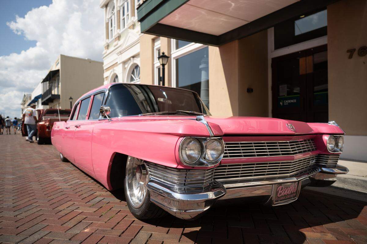 Event attendees check out cars Wednesday at the Biloxi Block Party.