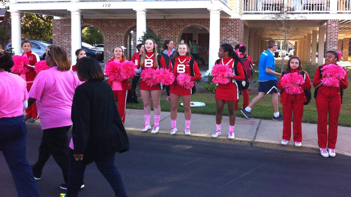 KATE MAGANDY/SUN HERALDBiloxi cheerleaders cheer on participants in the Making Strides Against Breast Cancer as they begin the 5K walk at the Biloxi Town Green on Saturday morning.