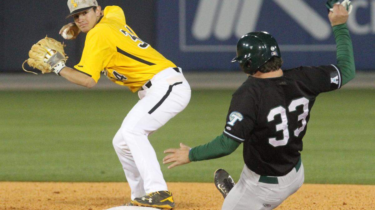JOHN FITZHUGH/SUN HERALD 
 USM's second baseman Storme Cooper looks to first after forcing out Tulane's Jeremy Montalbano during the second inning of their game at MGM Park in Biloxi on Tuesday March 22, 2016.