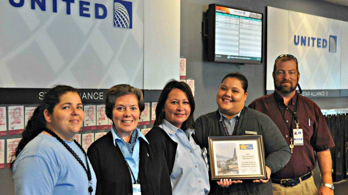 GULFPORT-BILOXI AIRPORTShowing the award for early or on-time departures are, from left, Sommer Cox, Guillerma Chaisson, Christina Rollman, Candice Burns and David Sanderson in front of the United Airlines station at the Gulfport-Biloxi International Airport.
