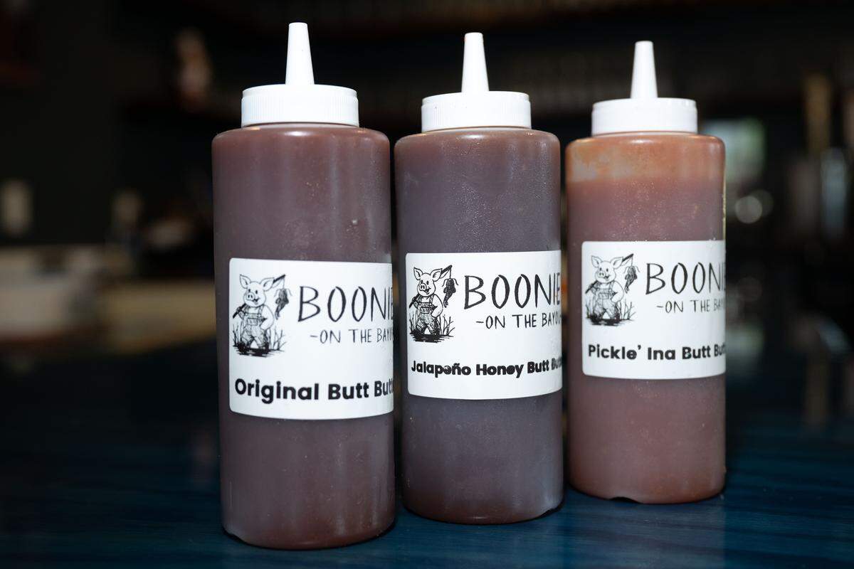 The original butt butter sauce, jalapeño honey and pickle barbecue sauces at Boonies on the Bayou on Friday, Dec. 5, 2025.