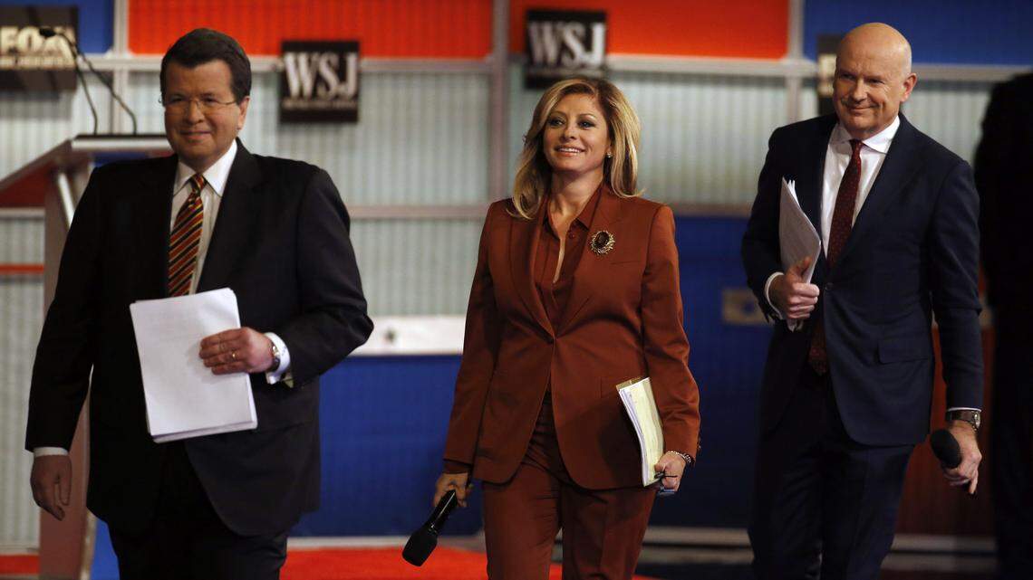 Moderators Neil Cavuto, left, Maria Bartiromo and Gerard Baker arrive on stage before the Republican presidential debate at the Milwaukee Theatre, Tuesday, Nov. 10, 2015, in Milwaukee. (AP Photo/Morry Gash)