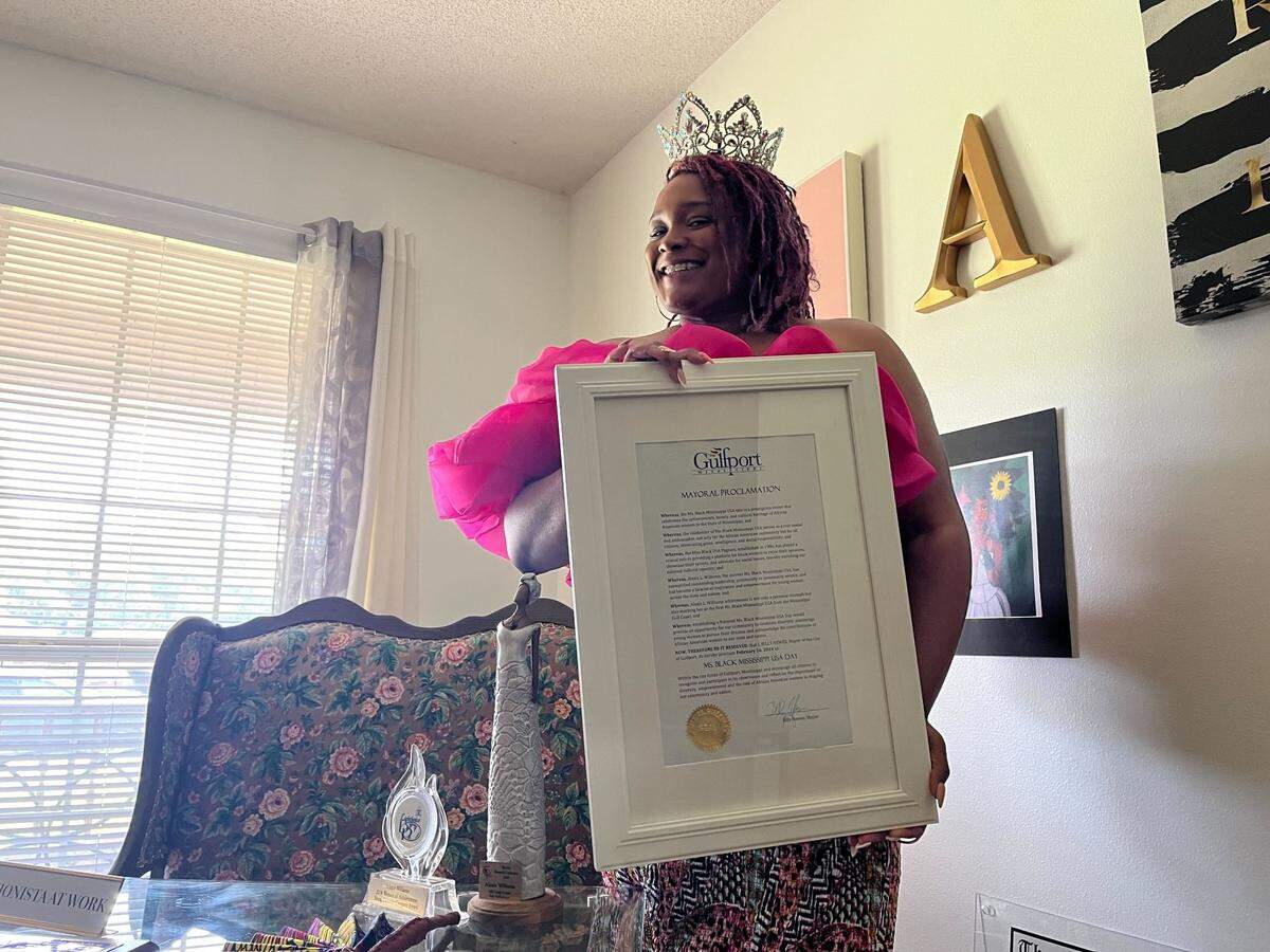 Alexis “Lexi” Williams holds a mayoral proclamation signed by Gulfport Mayor Billy Hewes in her home on Friday, July 12, 2024.