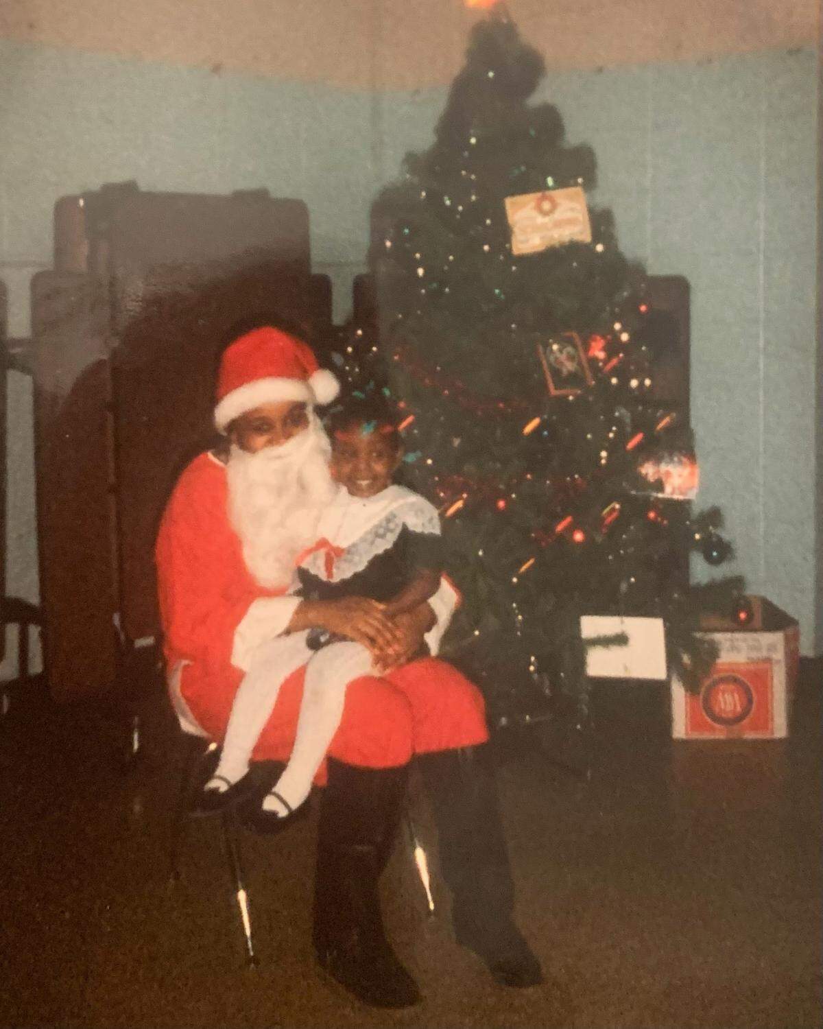 Porsche Spann, a photographer who splits her time between Gulfport and Pensacola, posed with Santa at her Head Start center in Chicago as a kid in the 1990s.