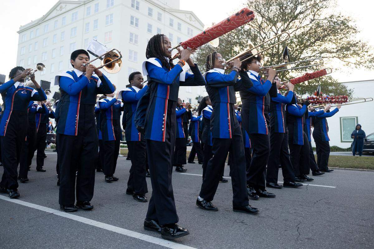 Gulfport band members play songs as they march during the Champions Christmas Parade in Gulfport on Monday, Dec. 8, 2025.