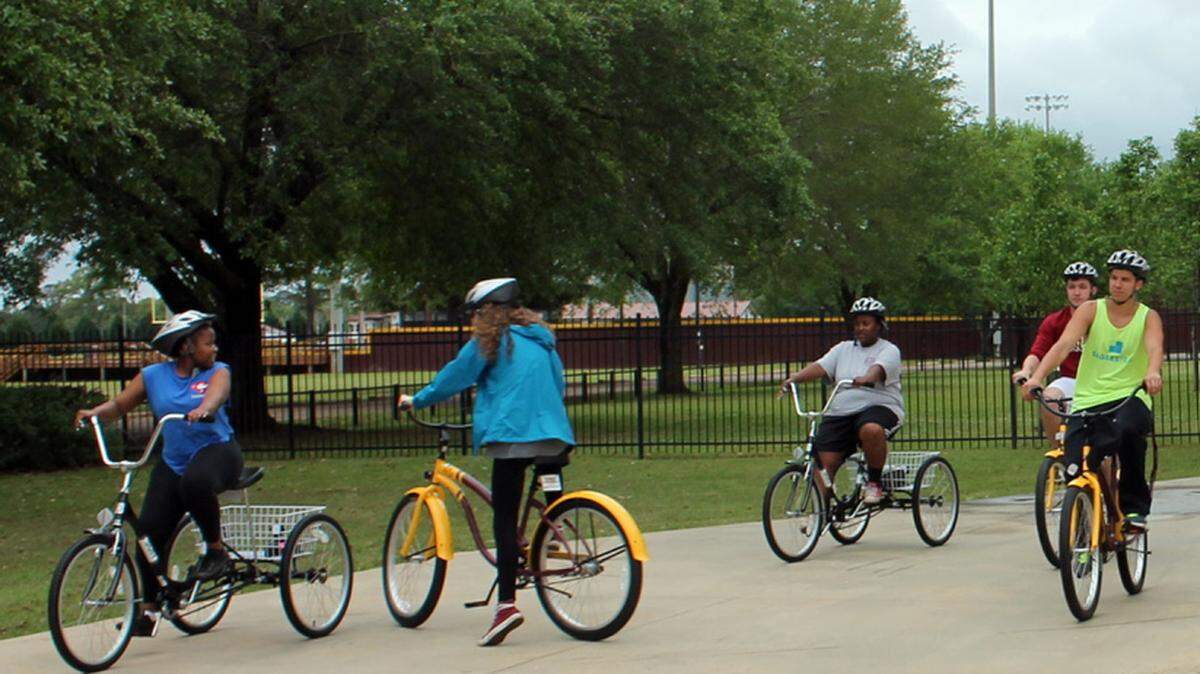 PRCC PUBLIC RELATIONSPearl River Community College students try out the loaner bicycles and tricycles during the Wildcat Wellness Bike Kickoff on Tuesday at Dobie Holden Stadium.