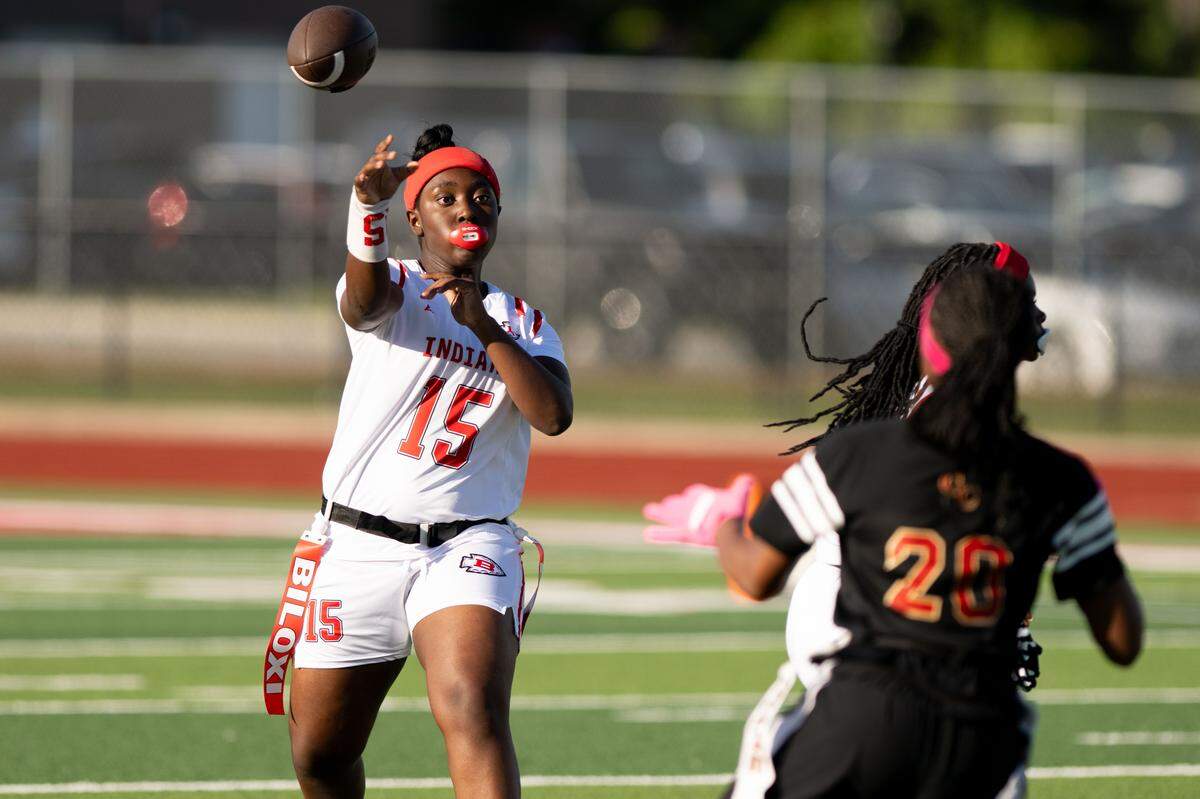 Biloxi’s Taylor Hannah (15) passes the ball during a flag football playoff game at Biloxi High School on Monday, May 4, 2026.
