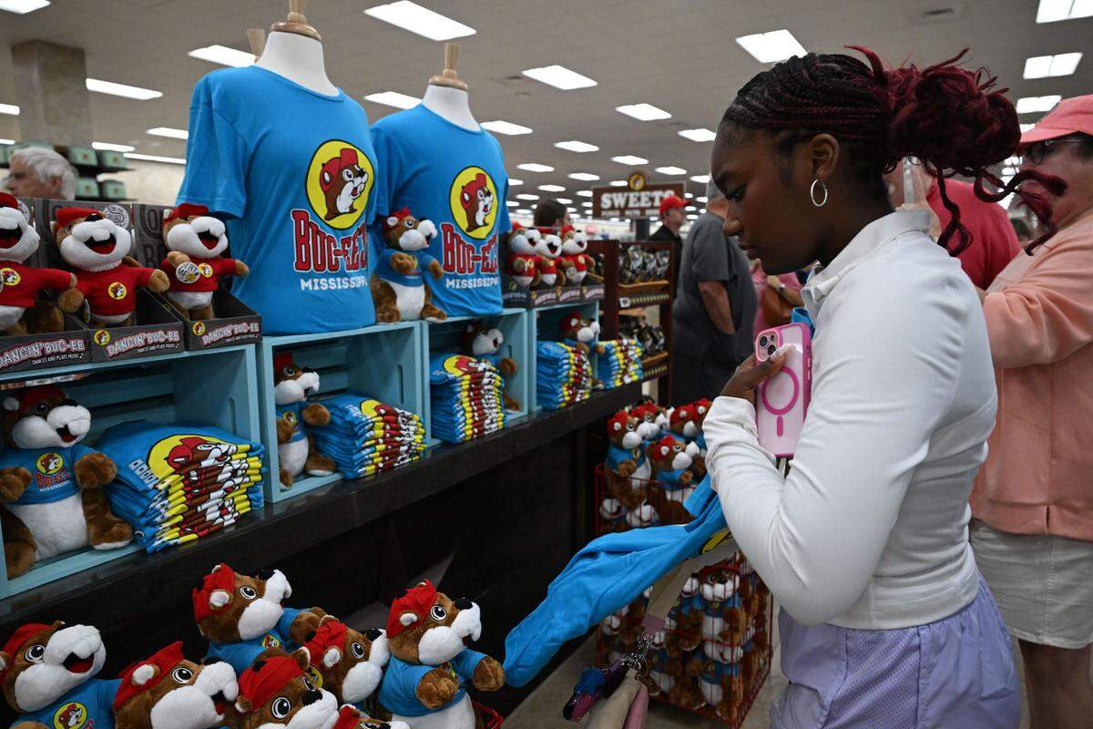 Customers flocked to the Buc-ee’s-branded T-shirts and gifts after the doors opened Monday in Harrison County.