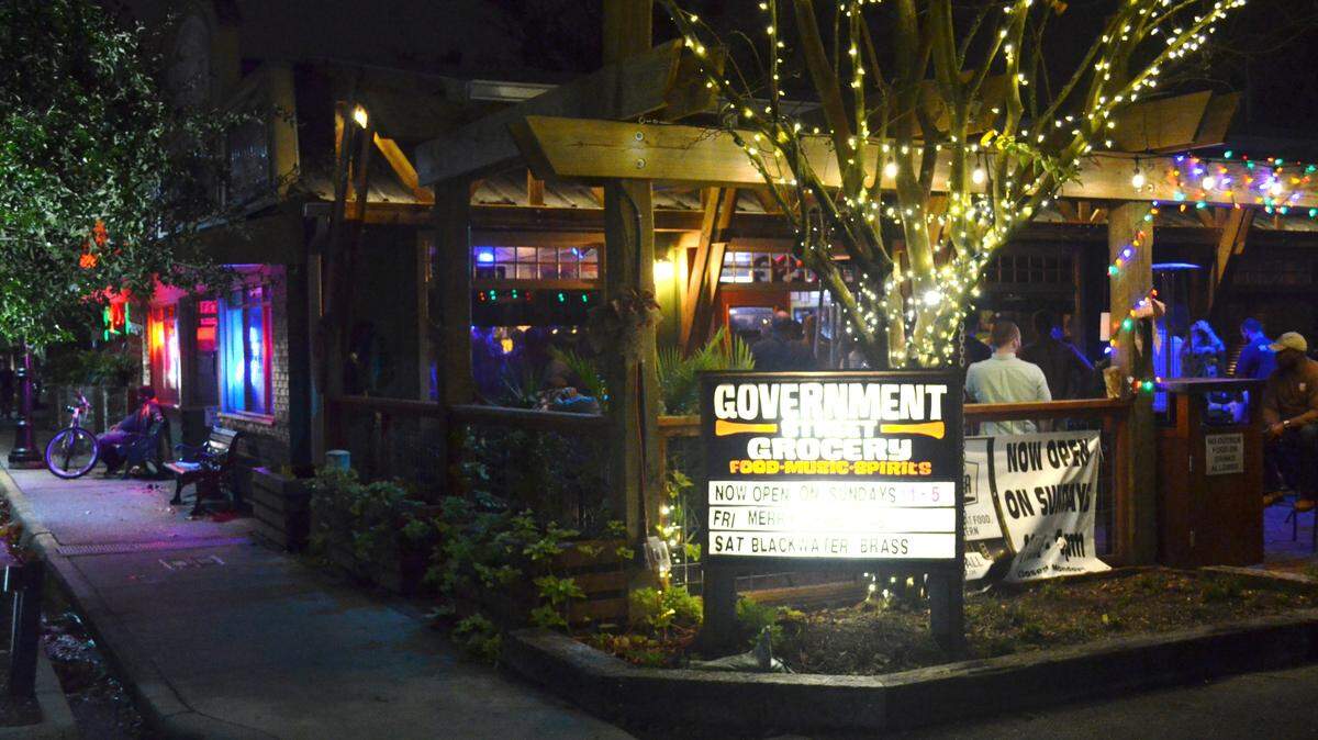 GENE COLEMAN/SPECIAL TO THE SUN HERALD 
 The Government Street Grocery helped set the Ocean Springs downtown nightlife scene rolling 10 years ago. Murky Waters is seen in the background.